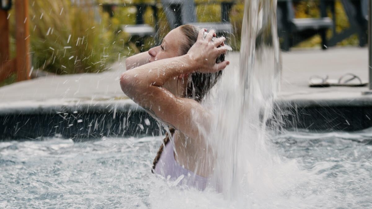 under the pool waterfall - Nordique Spa Stoneham
